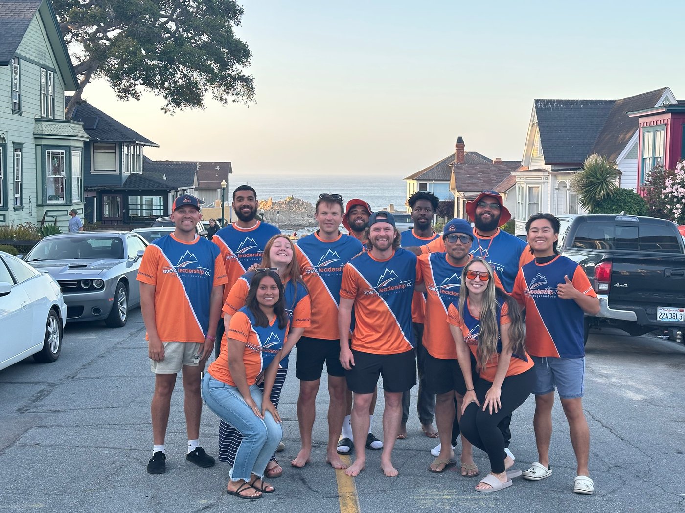 The Apex San Diego team in matching Apex jerseys on a coastal street