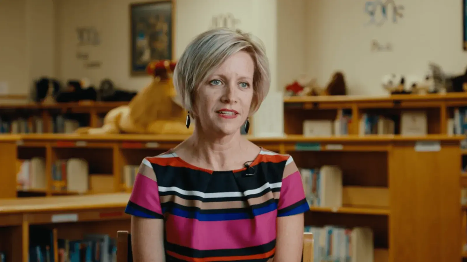 Video thumbnail of a school staff member sharing her Apex fundraiser experience in a school library