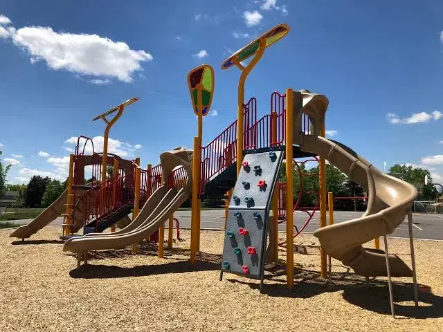 A colorful new school playground with slides and climbing towers